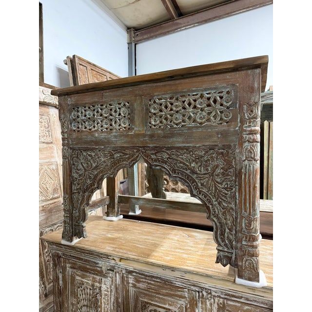 Add architectural charm and old-world character to your home with this vintage hand-carved console table, featuring an...