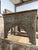 Add architectural charm and old-world character to your home with this vintage hand-carved console table, featuring an...