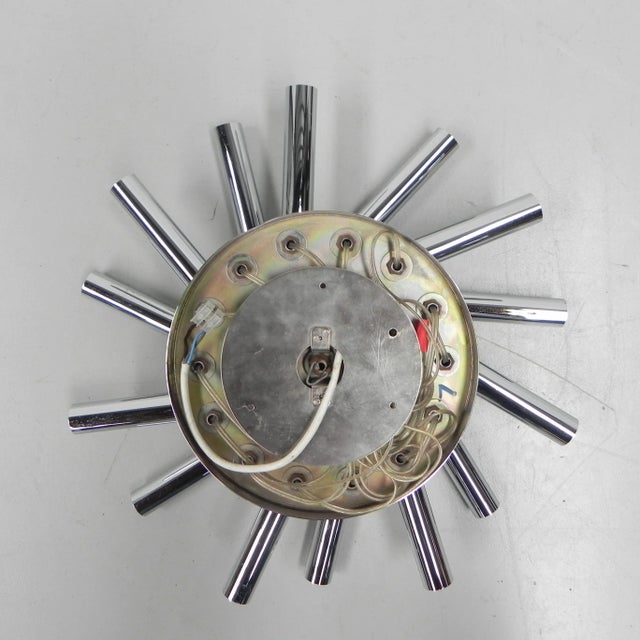 Height: 17 cm. Ø: 50 cm. Cylinders: length: 19 cm, Ø: 3 cm. Origin: Belgium, 1970s. Material: chromed brass. This piece is...