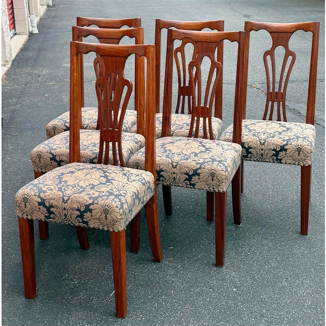 Gorgeous set of 6 Hepplewhite style dining chairs. Impeccably crafted from solid rosewood these chairs are built to last...