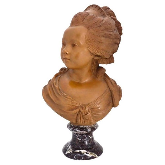 An antique French Classical terra cotta bust depicting a young Marie Antoinette, dating to approximately 1890. This finely...