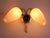 This stylish wall lamp is attributed to the renowned French lighting design company Arlus. The glass shades are encased in...