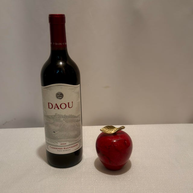 Elevate a simple desktop stack into a curated work of art with this magnificent vintage hand-carved solid red marble apple...