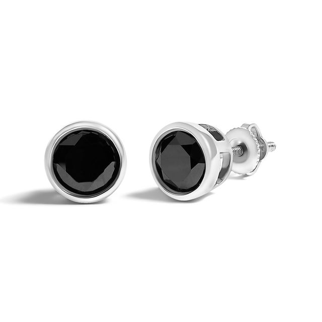Elegant and timeless, these gorgeous .925 sterling silver solitaire stud earrings feature bold and beautiful heat treated,...