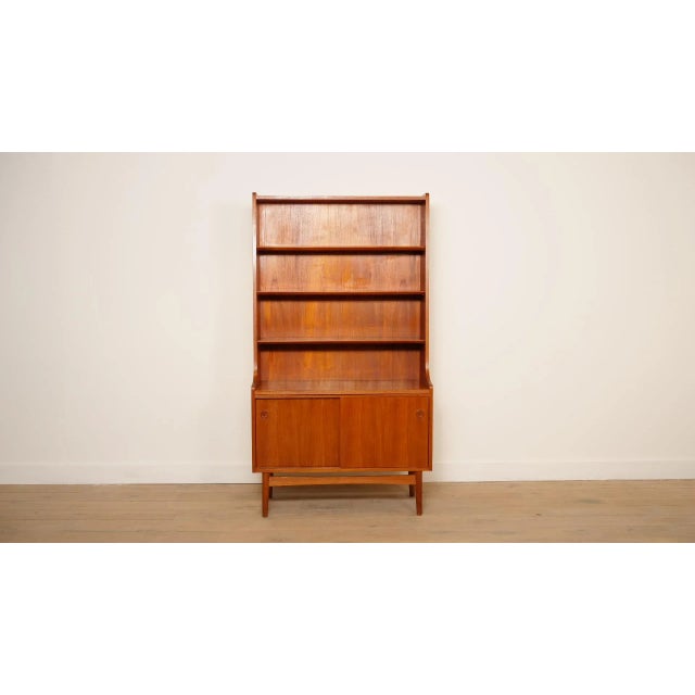 Beautiful highboard from the 1960s, from Denmark, designed by Johannes Sorth. The vintage cabinet has 3 shelves at the top...