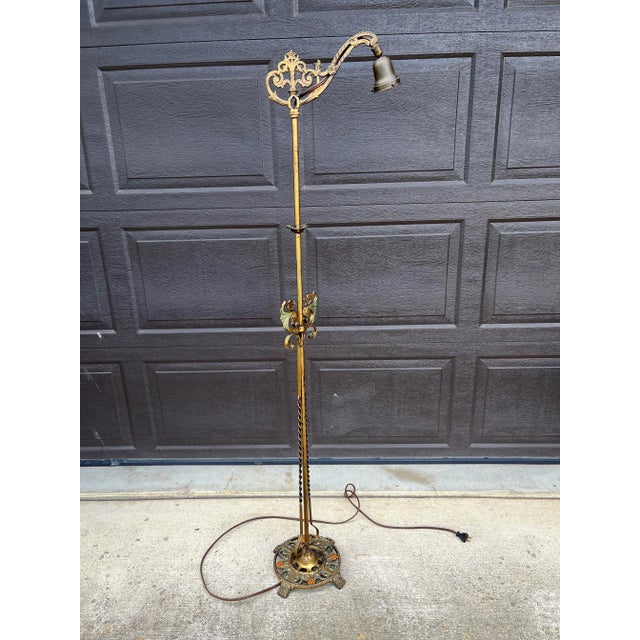 Wonderful ornate details, claw feet, floral motifs, and patina - make for a beautiful antique working piece! Uses a...