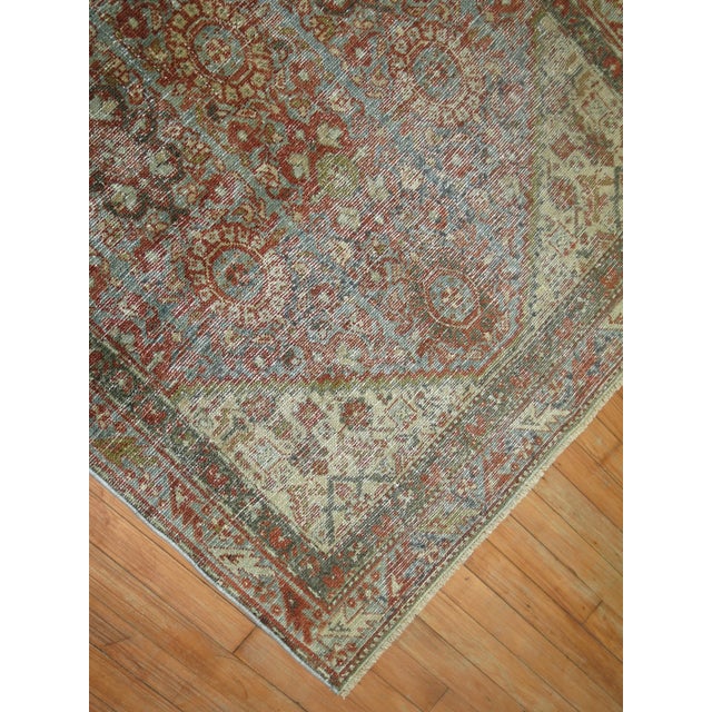 An early 20th-century wool hand-knotted Persian Malayer Rug in rustic tones