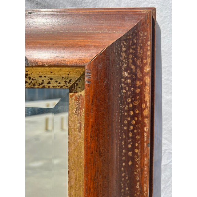This stunning extra large mirror has a solid walnut wood frame with a gold interior band and light distressing throughout....
