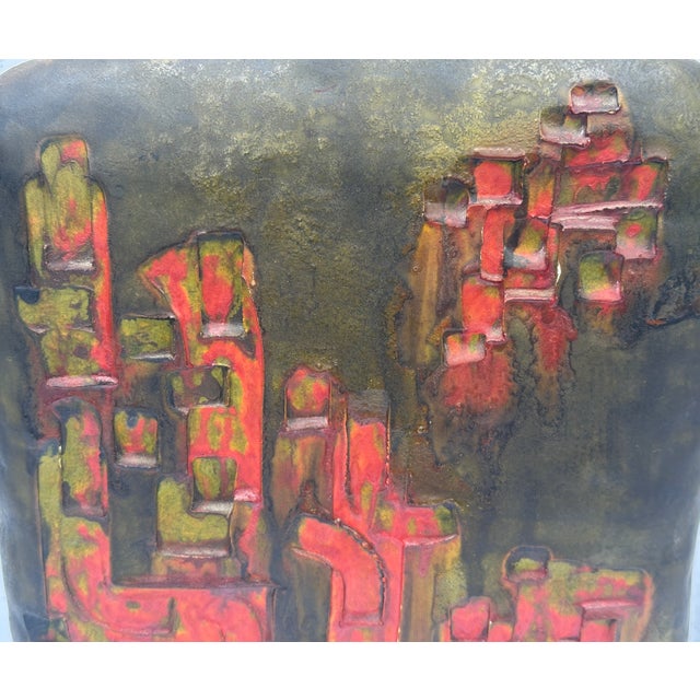 Here we have a large detailed cityscape in red against a green brown background by the master Marcello Fantoni , Very good...