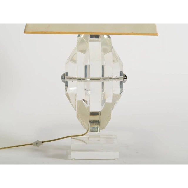 Octagonal thick Lucite form with chrome details.