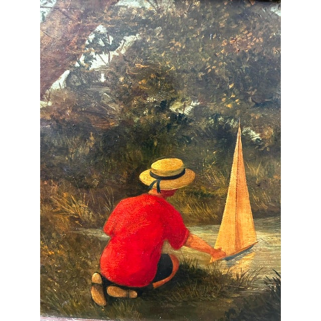 Charming antique oil on board painting of a boy and his sailboat. The painting was purchased from an antique dealer...