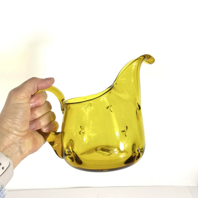 This stunner is so unique! Starting with the unusual colour which is a yellowy amber. The pitcher is short and squat with...