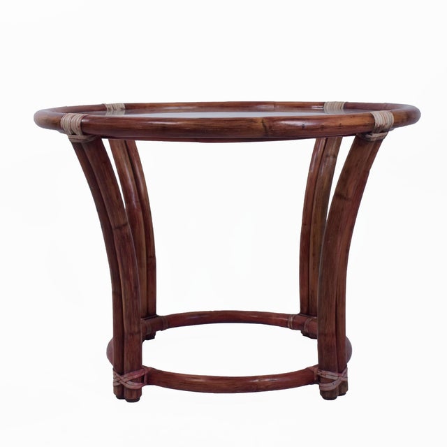 Round McGuire Coffee Table in nice as found vintage condition. There are scuffs, scrapes and wear to the as found finish....