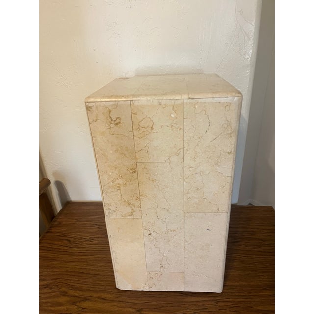 Great beige travertine plinth pedestal table. It is a postmodern style stand often used to display sculptures, plants, or...