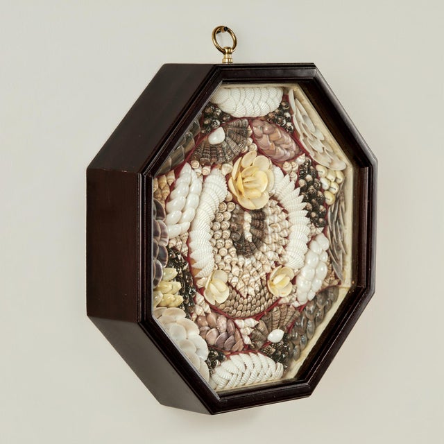 Charming vintage sailors valentine ambitiously handcrafted in exotic organic seashells. Presented under glass in an...