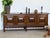 Danish sideboard in stained solid oak, by Henning Kjærnulf, 1960s. The case is fitted with four doors, each set with a...
