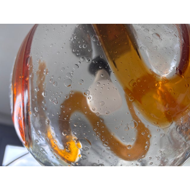 Italian hand-blown glass pendant light in perfect condition, chromed steel and wood frame This piece is attributed to the...