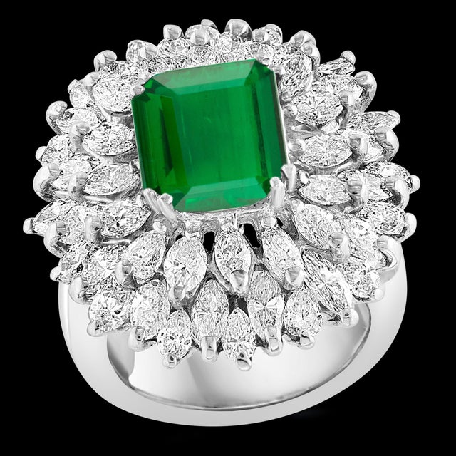 **4 Carat Emerald Cut Colombian Emerald & 5.5 Ct Diamond Ring in Platinum Size 6** A classic ring featuring a stunning 4...
