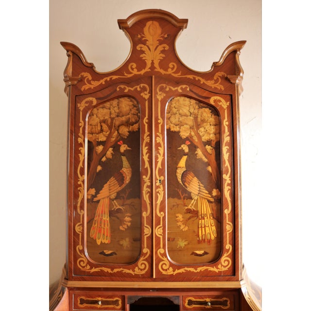 Limelight with a belief made in Italy finely inlaid with two central doors. Intorsia characterized by two peacocks facing...