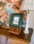 This little framed print is so sweet. It depicts the Eagle Bluff Lighthouse in Door County, Wisconsin, by artist Phillip...