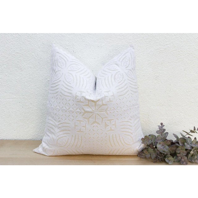 This decorative pillow cover features beautiful array of patterns, with hand crafted appliqué cut work, giving it a...