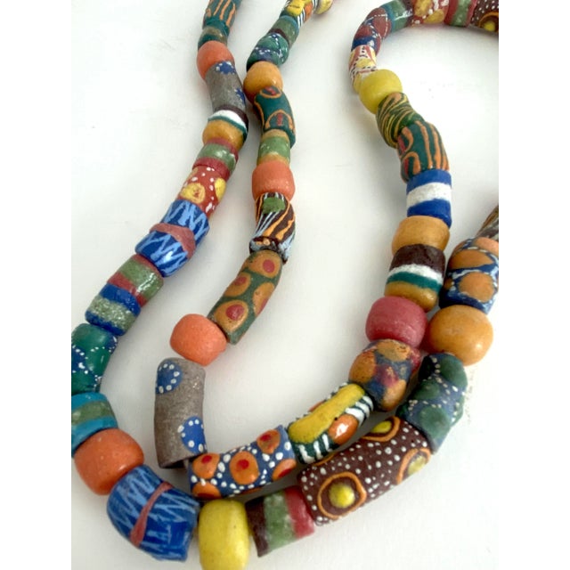 Vintage handmade African trade beads strung on raffia. A nice addition to layer or drape over home decor elements. These...