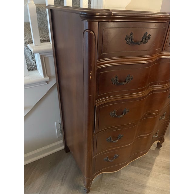 The color is FRENCH WALNUT, with 5 drawers and 1 divided drawer. All drawers work and the hardware is original....