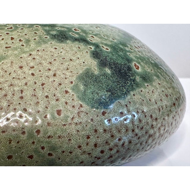 An impressive modernist studio ceramic art vase in Japanese Raku-Style from the 1970s. The fine flat shaped vessel...