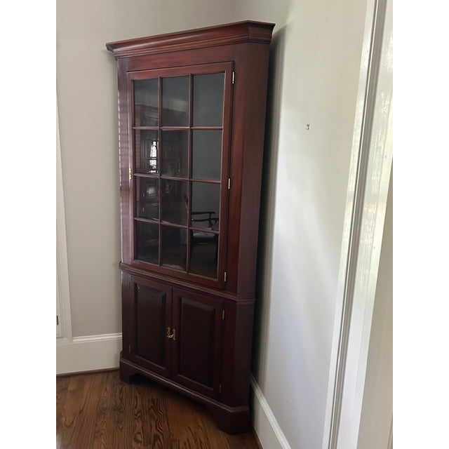 Council Craftmen corner cabinet. Lighted. Approximately 41" wide by 83' high. There are no visible markings, labels, or...