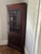 Council Craftmen corner cabinet. Lighted. Approximately 41" wide by 83' high. There are no visible markings, labels, or...