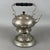 An elegant vintage tea set with a tilting teapot on a stand and a built-in burner, attributed to 20th-century manufacture....
