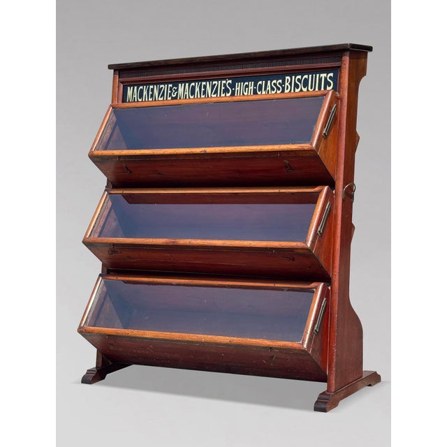 A “Mackenzie & Mackenzie's High Class Biscuits” Victorian Period Mahogany Trade Display Biscuit Cabinet, circa 1880 This...