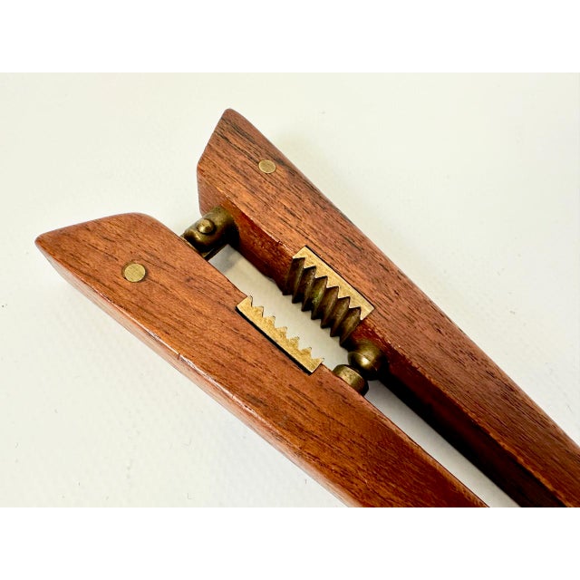 Mid-Century Modern Teak and Brass Nutcracker by Poul Knudsen, 1950s, in Very Good conditions. Designed 1950 to 1959 This...