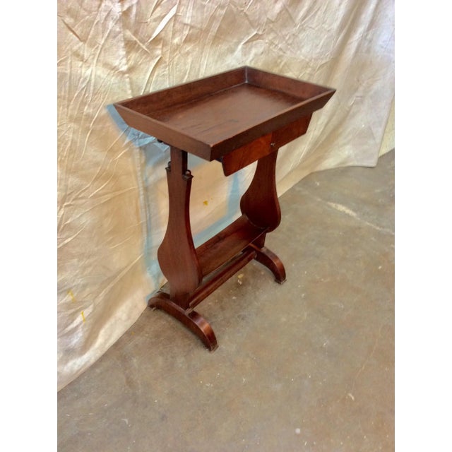 Found in the South of France, this petite Early 20th Century French Walnut Side Table is crafted with a raised edge top,...