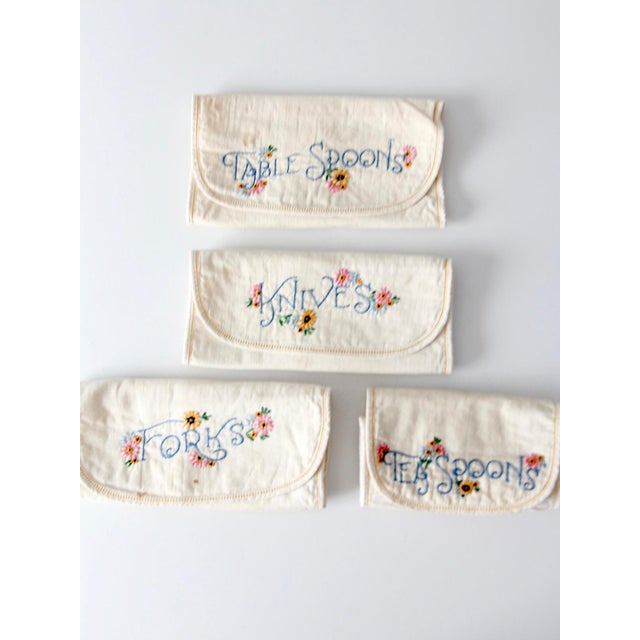 This vintage set of embroidered silverware holders features labeled organizers for forks, knives, teaspoons, and...