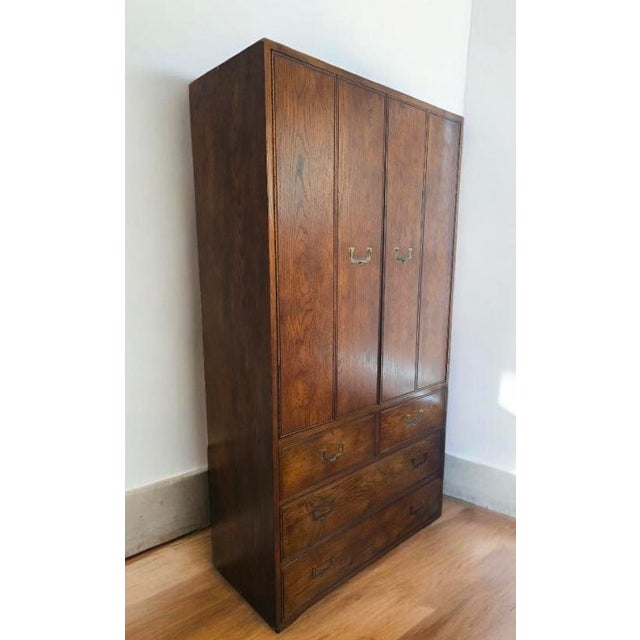 The striking example of American luxury furniture designed from the 1970s is crafted from solid oak/veneer with iconic...