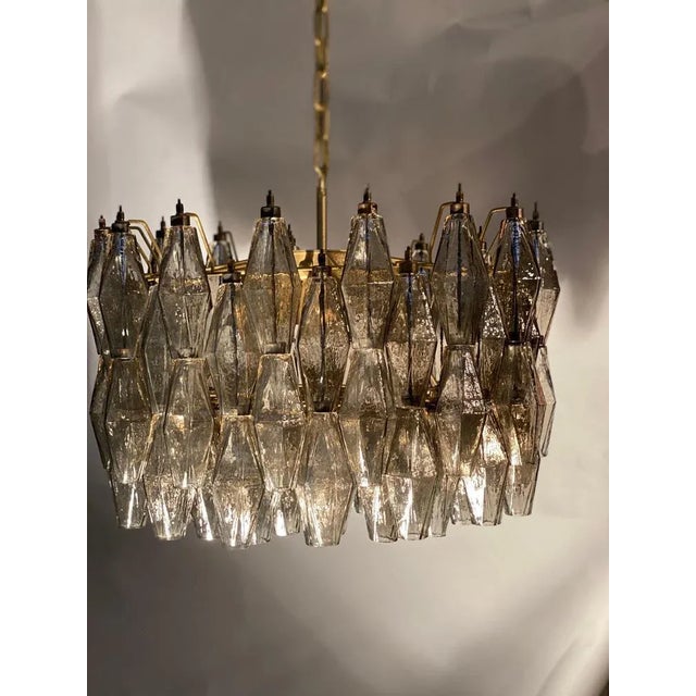 The chandelier consists of 103 hand blown grey "Poliedri" made of murano glass. Edition limited from a great master of...