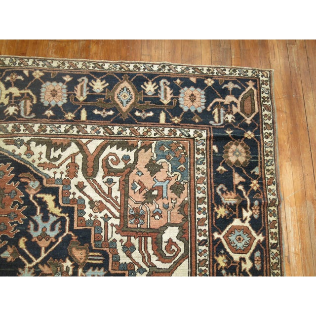 Room size Masculine Persian Heriz rug in predominant browns, charcoal and navy blue colors. Measures: 9'9" x 12'5"...