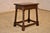 19th century oak joint stool from England. The top has a beveled edge, following down to a hand carved decorated and...