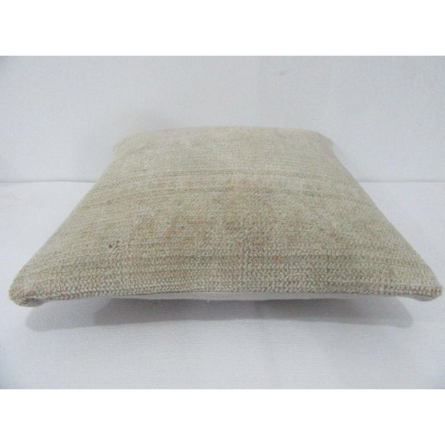 Decorative pillow cover made from a vintage Turkish handknotted rug. Backed with good quality cotton fabric. Pillow...