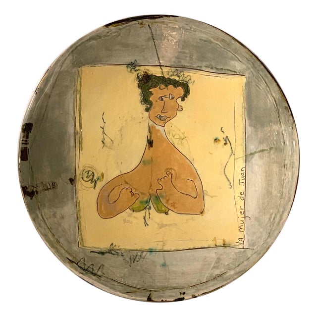 Early 20th Century "La Mujer de Juan" Glazed Pottery Charger For Sale