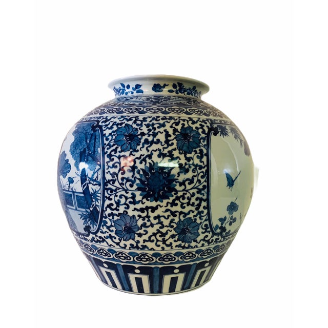 Gorgeous large antique Chinese porcelain vase. Features a body with several motifs beautifully hand painted in cobalt...
