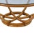 A large round rattan coffee table that anchors a sitting area with warm, natural texture. The round silhouette keeps...