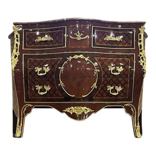 French Louis XV Style Brown Commode With Gold Leaf Details For Sale