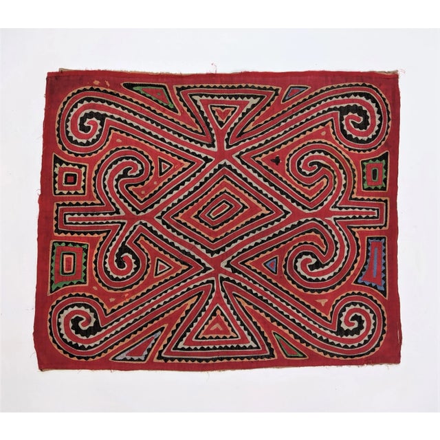 Gorgeous handmade textile by the Guna (Kuna) people from Panama. Molas have their origin in body painting. After spanish...