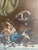 The oil painting is signed by the artist, L.Chaffee and it is dated 1905. The kittens are playing with cherries that are...
