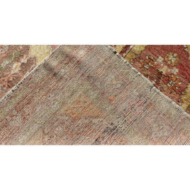 Vintage Oushak Rug With Two Medallion Panels in Yellow, Brown, Orange and Soft Red For Sale In Atlanta - Image 6 of 6