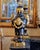 Elegant French Empire-style decorative urn crafted in rich black porcelain and embellished with elaborate gilded bronze...