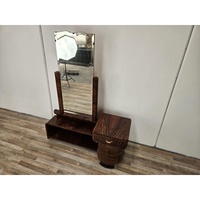 An elegant original Art Deco dressing table from the 1940s, crafted from fine walnut burl with a beautiful flamed grain...