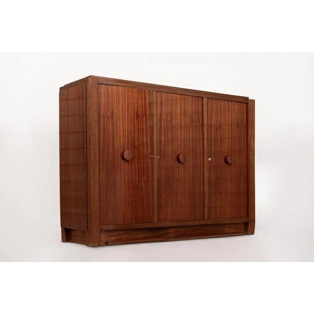 This truly exceptional Art Deco wooden sideboard or bar cabinet was designed by Andre Sornay (attr.) in France circa 1930....